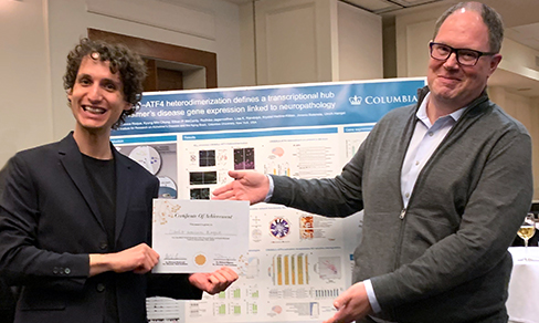 Pictured from left to right: Best Poster Winner Cláudio Gouveia Roque, PhD with Ulrich Hengst, PhD (PI).